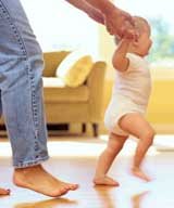 Child learning how to walk with the comfort of heated floors